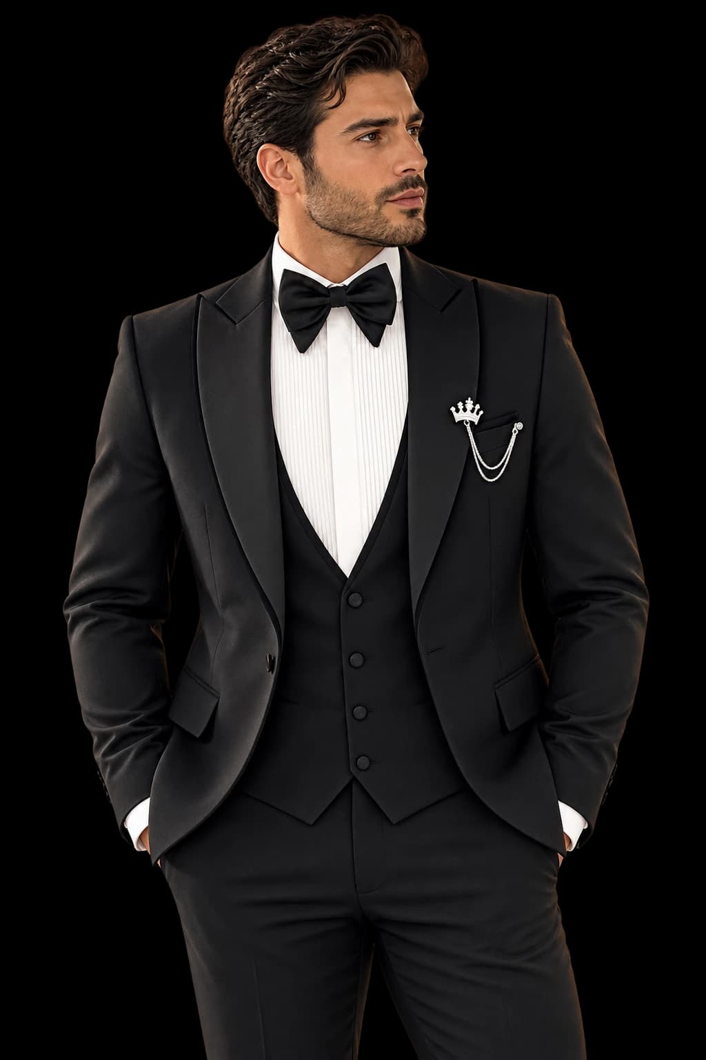 Black peak-lapel tuxedo with bow tie and crown chain pin, by Barberini Uomo
